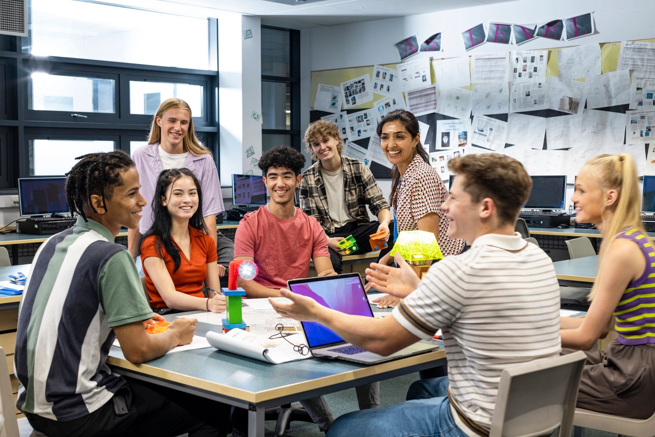Diverse students and instructor in a modern technology classroom