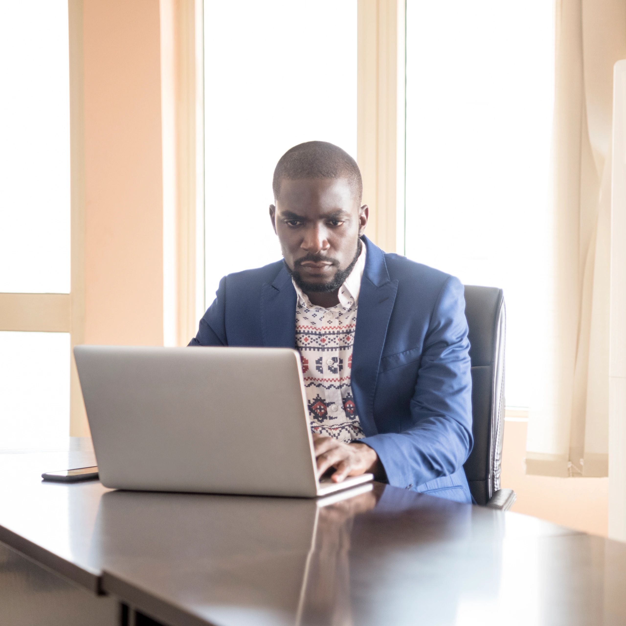 Black African student using a laptop in class